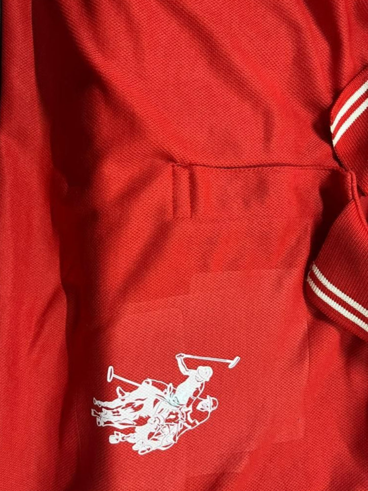 Red jacket with a white logo on a red background